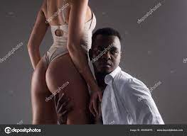 Multiethnic couple. Interracial sex. Passionately embracing. Sexy love.  Erotic and desire. Couple relationships. Woman lingerie. Stock Photo by  ©Tverdohlib.com 450894578