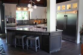 A black concrete countertop holds up to daily wear on the prep area. Kitchen Bath And Home Remodeling Dimensions In Wood