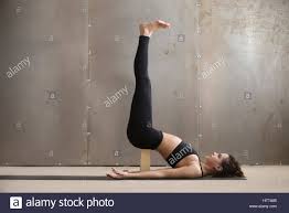 Young Attractive Woman In Viparita Karani Pose With Block Studi Stock Photo Alamy