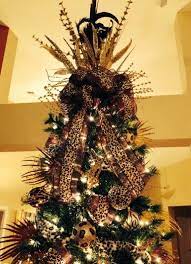 The shrewd leopard can survive in diverse environments and is found in the desert as well as the jungle. My Animal Print Christmas Tree 2013 Creative Christmas Trees Ribbon On Christmas Tree Black Christmas Trees
