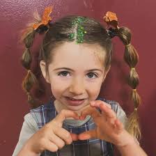 One YEAR with our new EAR !👂🏻” and festive Halloween hair too! Looking  GREAT, Miss Daisy! 🌼