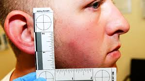 Protesters torch police car as troops guard Ferguson