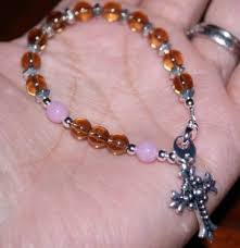 Children may play with it. How To Hold Rosary Beads