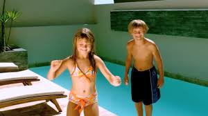 Dançando música das blackpink mais uma vez. Young Girl Dancing While Brother Jumping In The Swimming Pool Stock Video C Wavebreakmedia 25690815