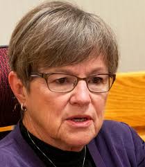 Schmidt denounces Kelly's approach to Kansas' foster care system