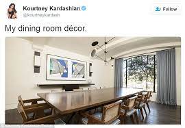 The simple modern black console table contrasts perfectly with the framed artwork and the metal sculptures that give this room the most modern design. Kourtney Kardashian Shows Off Dining Room Decor Ahead Of Annual Christmas Day Buffet Daily Mail Online