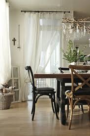 A bedroom with hardwood floors features windows that look out onto the home's patio is paired with a hallway bath with a tiled shower. Industrial Farmhouse Style In Iceland Farm House Living Room Farmhouse Style Curtains Joanna Gaines Dining Room