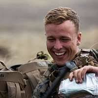 A Chadian military member waits his turn to complete