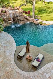 80 Fabulous Swimming Pools With Waterfalls Pictures Pool Waterfall Swimming Pool Designs Pool Designs