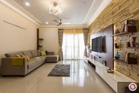 A 2bhk With A Unique Twist On Wooden Interiors Hall Interior Design Beige Sofa Living Room 2bhk House Plan