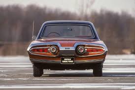 The interior of the 64 prototype heritage edition features lightspeed blue alcantara seats with silver stitching while the rest of the interior gets a mix of black leather and black alcantara. 1963 Chrysler Turbine Car Photos In 2021 Chrysler Turbine Chrysler Car