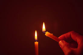 Man hands lighting candle on the table, super slow motion. Fototapete Candle Lit In The Dark Candle Flame At Night Lighting Design For Background Lighting Candles Burning Candle On Black Background Candle In The Dark Singjai