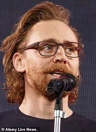 Loki is played by actor tom hiddleston. Tom Hiddleston Sports Long Hair And A Full Beard As He Takes To The Stage At Comic Con In Tokyo Daily Mail Online