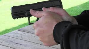 Image result for pictures of holding a handgun