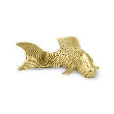 If the fish is already dead, and this may sound barbaric to some, but you may as well flush him down the toilet. Brass Koi Fish Decorative Object Williams Sonoma