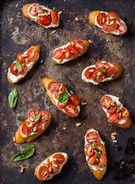 Take your balsamic reduction and drizzle over the top of the bruschetta pieces. Tomato And Basil Crostini With Whipped Goats Cheese Drizzle And Dip