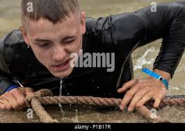 Jackson Hensley climbs out of 'Davey Jones' Locker', a 15 foot drop to a 15  foot deep pool obstacle during the 2016 Savage Race October 8, 2016 at  Kennedyville, Md. 70th ISRW participants endured a seven-mile obstacle  course of cargo net walls, creeks ...