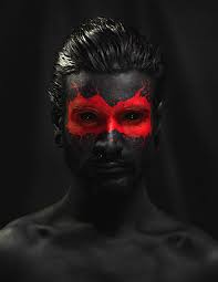 This gives the illusion of a dog snout. Red Face Paint Black Face Red Men Hd Wallpaper Wallpaper Flare Creative Portrait Photography Self Portrait Photography Portrait