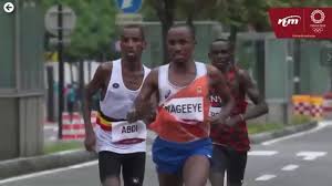 Marathon hug, eluid kipchoge, abdi nageeye, bashir abdi hug, do a dubler; Rgaphpgw4amfim