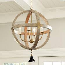 Let a chandelier brighten your space. Clarissa Wood Orb Cage Black Tassel Chandelier