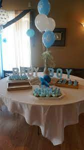 If there's going to be several tables where guests will be seated, you will need baby shower centerpieces for each table. Dessert Table Baby Boy Cardboard Letters And Center Piece For Baby Shower Baby Shower Table Baby Shower Table Favors Baby Shower Table Decorations