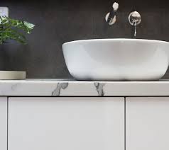 Brass faucets and hardware add metallic glam to the space. Custom Bathroom Vanities Custom Made Entertainment Unit Designs