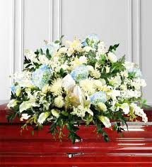 While many funeral arrangements incorporate white flowers, blue, pink, purple, and red can also be included for a subtle pop of color. Blue Sympathy Casket Spray Avas Flowers