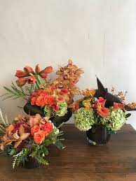 Corporate Arrangements With Roses Cymbidium Orchids Amaryllis Hydrangea And Calla Lilies Corporate Flowers Flower Delivery Flower Subscription