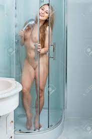 Young Beautiful Naked Woman With Long Blond Hair Taking Shower In Shower  Stall Stock Photo, Picture and Royalty Free Image. Image 97821476.