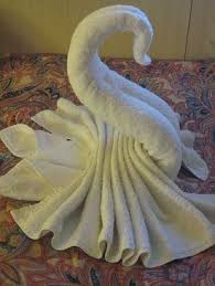 Your guests may even be so impressed by your pretty towel folds that they will fail to notice the free acupuncture offered courtesy of the springs that jab them through the holes in your sofa bed. Towel Animal Swan Towel Animals Towel Origami How To Fold Towels