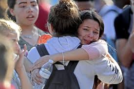 Medical personnel tend to a victim after a mass. Gunman Kills 17 In Florida High School Shooting Wsj