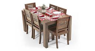 The dining chairs are upholstered and styled by nailhead trim. Arabia Capra 6 Seater Dining Table Set Urban Ladder