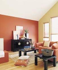 If you want to make orange a dominant color in your living room, you may want to balance it. Orange Red And Cream With Black Furnishings Living Room Orange Living Room Color Schemes Yellow Dining Room