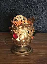 The color of candles in the holders should coordinate with the rest of the room. Brass Candle Holder Bejeweled Filigree Votive Holder 4 Jewels 5 75 Inches Tall Brass Candle Holders Candle Holders Votive Holder
