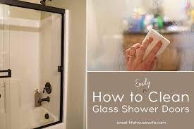 How To Clean Glass Shower Doors A Real Life Housewife Glass Shower Doors Cleaning Hacks Cleaning