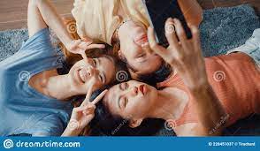 Above View Close Up Group of Asia Ladies with Happiness Enjoy Moment Hold  Smartphone Smiling Take Memories Picture Lying on Carpet Stock Image -  Image of asian, girls: 228451037