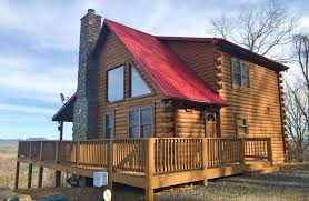 The noted boat house is perfect for an office work space, accented w/a cathedral ceiling, is complete with electrical service & roughed in plumbing Log Cabin West Jefferson Nc