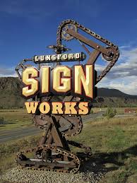 Lunsford Award Winning Think A Ma Jig Sign Coastal Enterprises Commercial Signs Signage Design Carved Signs