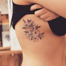 Rib tattoos are lovely but veiled for girls. ì¢…ì´í•™ê³¼ ë²šê½ƒ Papercrane Papercranetattoo Cherryblossom Cherryblossomtattoo Linework Linetattoo Tattoo Grain F Cage Tattoos Ribcage Tattoo Tattoos For Women Flowers