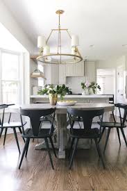 Ripley Dining Chairs Round Gray Wash Dining Table Brass Chandelier Light Gray Cabinetry Glamourous Dining Room Grey Dining Tables Dining Room Inspiration
