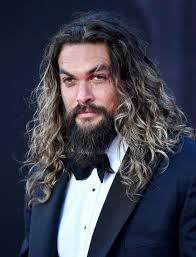 Jason Momoa's style in a tux with long hair