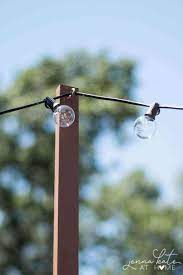 Drive the pvc into the ground by hitting it. The Easiest Way To Hang String Lights On Your Deck Jenna Kate At Home