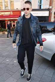 Robert Pattinson With A Shaved Head And Wearing A Leather Jacket Carhartt Jacket Well Dressed Men Best Dressed Man