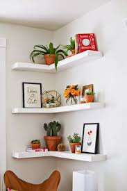 These corner floating shelves are hanging on three walls. 13 Unexpected Ways To Decorate With Plants Small Bedroom Hacks Floating Corner Shelves Home Decor