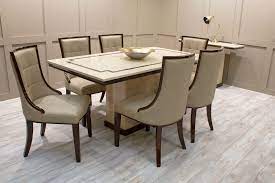 Marble table with suede chairs texture. Alfredo Dining Table Furniture Foy Company