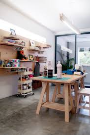 Studio Workshop Interior By The Association Hdb Interior Wood Ply White Pegboard Sewing Studio Art Artroom Interior Home Studio Room