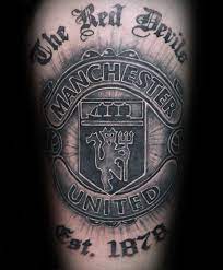 Small tattoos are not a girl's thing anymore. 40 Manchester United Tattoo Designs For Men Soccer Ideas Tattoo Designs Men Man Utd Tattoo Crest Tattoo