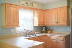 Rainwashed, by sherwin williams, is the perfect bluish green color to coordinate with your honey oak kitchen cabinets. Wall Colors For Honey Oak Cabinets Love Remodeled