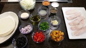 Serving up authentic american food with a mexican flavor and taste. In The Kitchen Grilled Fish Tacos