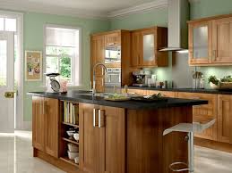 Beautiful Walnut Cabinets And Cool Green Walls Make This Dream Kitchen Fresh And Welcom Cherry Wood Kitchen Cabinets Wood Kitchen Cabinets Cherry Wood Kitchens